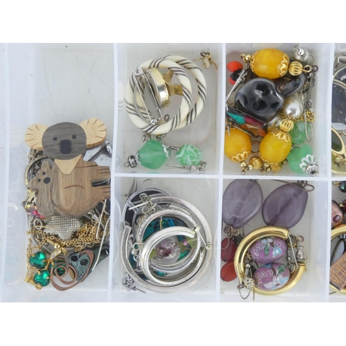 97 - A lot of assorted metal and costume earrings, brooches etc.