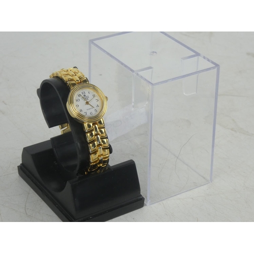 106 - A cased Medici Gold Quartz ladies wrist watch.