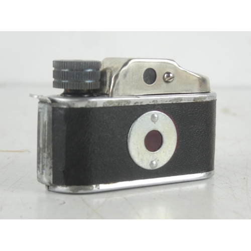 113 - A miniature Minetta camera in leather case.