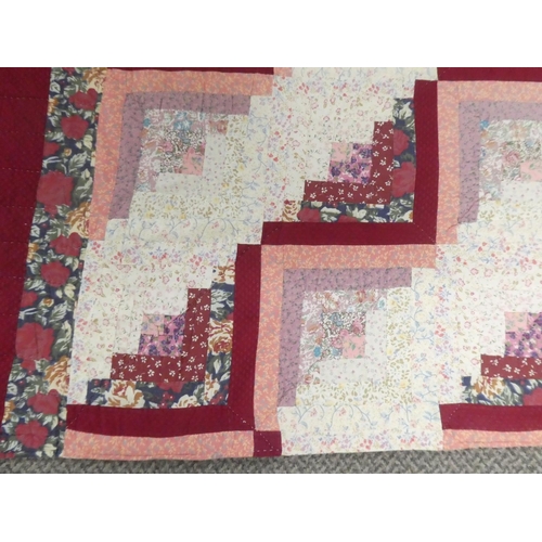 139 - A vintage 1970's hand quilted. patchwork blanket.