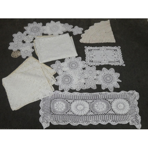 140 - A collection of hand made place mats to include crochet, macrame, embroidery etc.