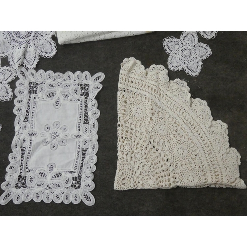 140 - A collection of hand made place mats to include crochet, macrame, embroidery etc.