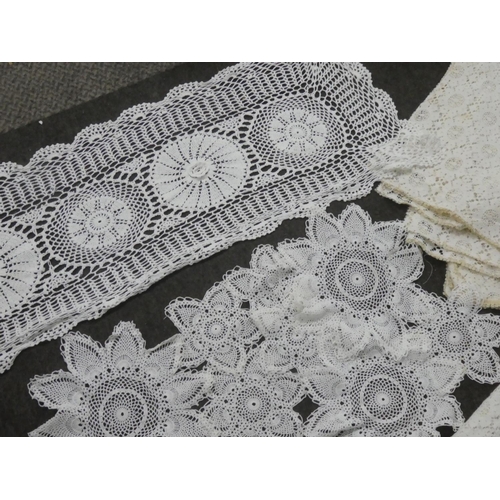 140 - A collection of hand made place mats to include crochet, macrame, embroidery etc.