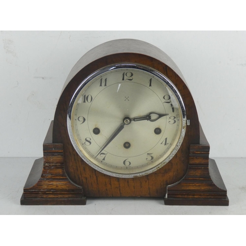 152 - A vintage oak cased mantle clock.