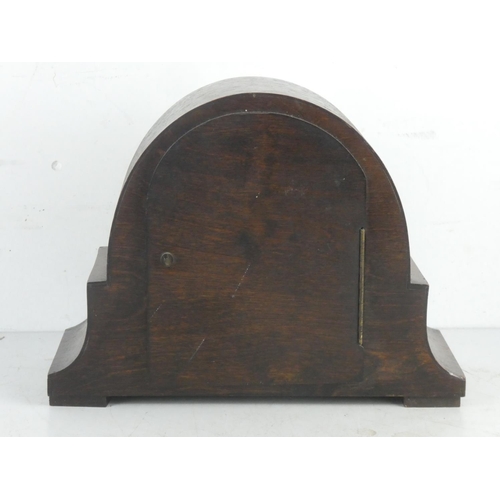 152 - A vintage oak cased mantle clock.