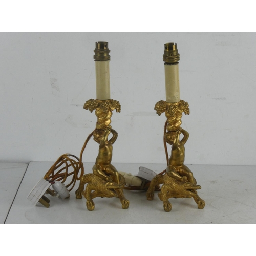 162 - A stunning pair of heavy brass table lamp bases in the style of a crocodile and cherub, measuring 32... 