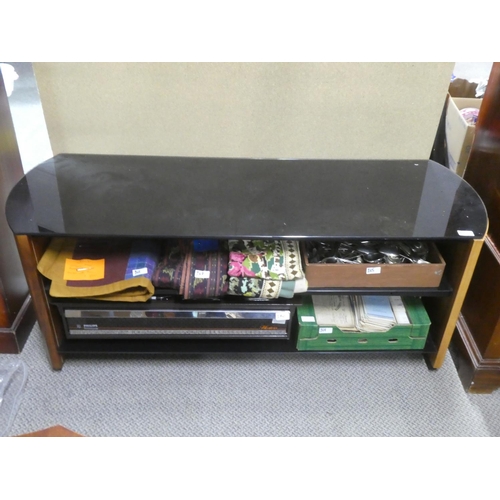 164 - A large glass topped coffee table with two shelves.