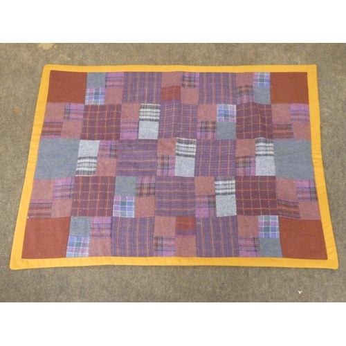 168 - A stunning patchwork quilt made from Donegal Tweed and a linen back.