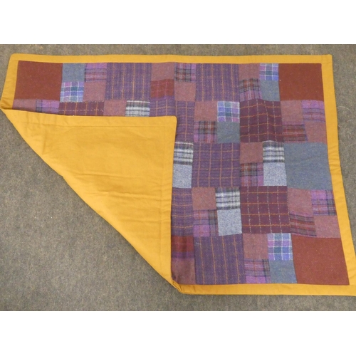 168 - A stunning patchwork quilt made from Donegal Tweed and a linen back.