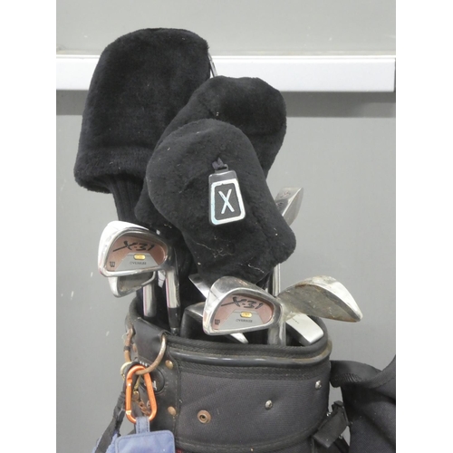 217 - A vintage Regal golf bag and a lot of Wilson golf clubs and more.