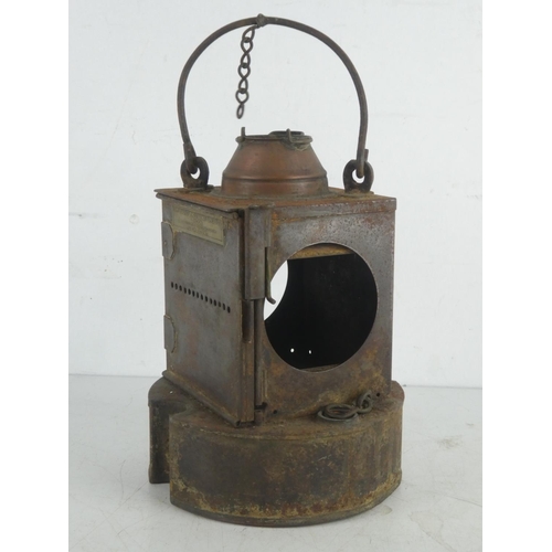 221 - An antique LMS railway lantern produced by Lamp Manufacturing & Railway Supplies Ltd, London.