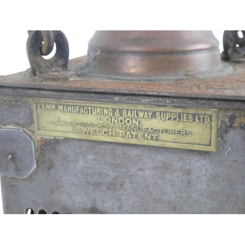 221 - An antique LMS railway lantern produced by Lamp Manufacturing & Railway Supplies Ltd, London.