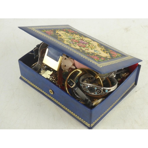 225 - A vintage jewellery box and its contents.