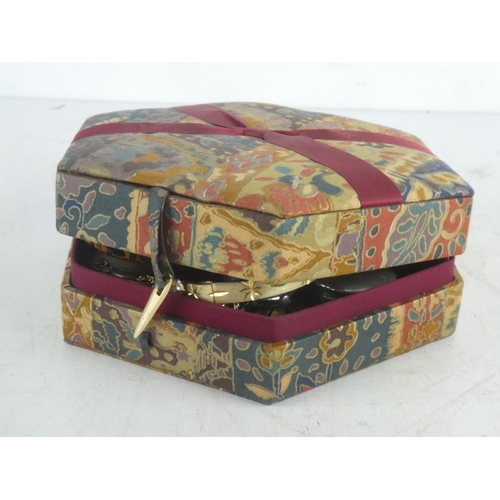 226 - A vintage jewellery box to include bangles, watches, brooches etc.