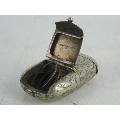 230 - A vintage metal and engraved vesta case, another in the style of a book and a snuff box.