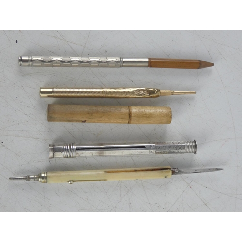 231 - A collection of five antique propelling pencils.