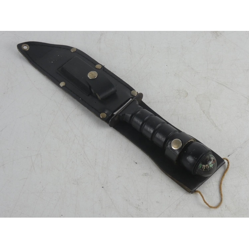 234 - A divers knife with compass handle and sheath.