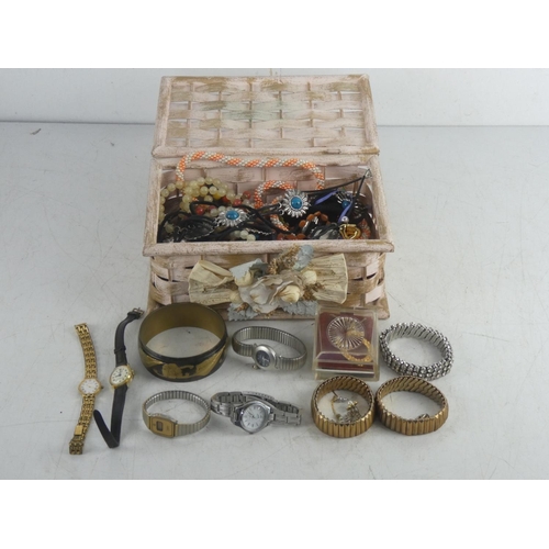 248 - A vintage rattan jewellery box and contents to include a Slazerger wrist watch, a decorative brass b... 