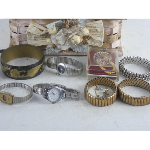 248 - A vintage rattan jewellery box and contents to include a Slazerger wrist watch, a decorative brass b... 