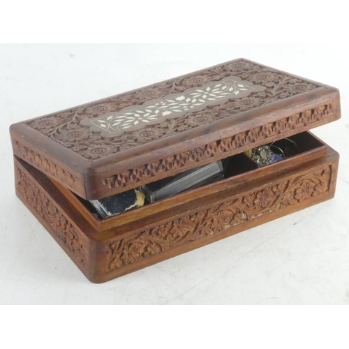 249 - A wooden carved jewellery box containing a lot of vintage brooches etc.