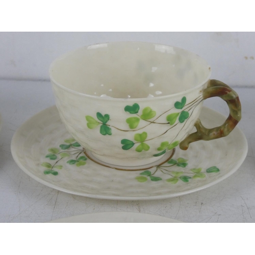 269 - A collection of early 2nd period Belleek pottery cups, saucers and plates.