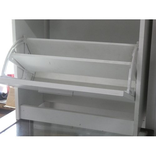 306 - A two drawer shoe rack.