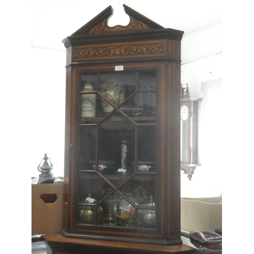 308 - An antique corner cabinet with astral glazed door.