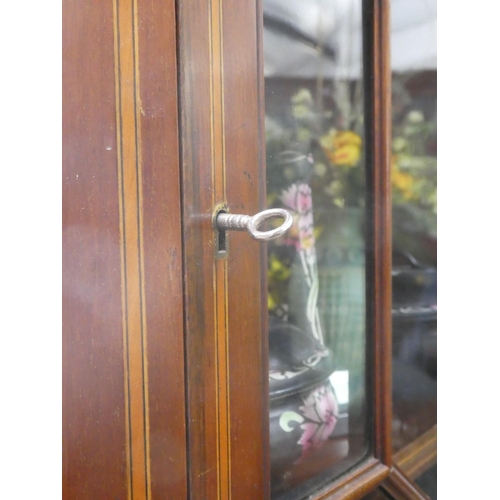 308 - An antique corner cabinet with astral glazed door.