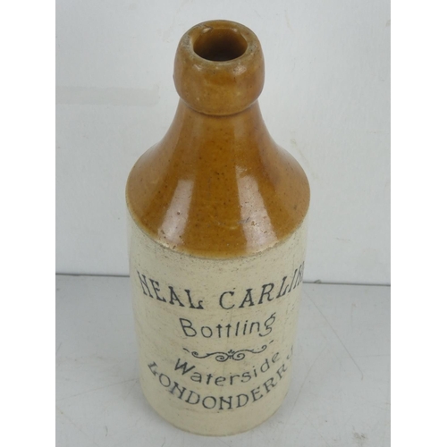 309 - An antique Neil Carlins, Waterside, Londonderry stoneware beer bottle.