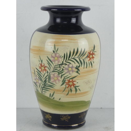 310 - An Oriental patterned vase, signed to base.