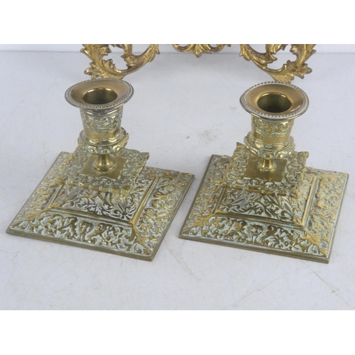 315 - A stunning pair of decorative brass candlesticks and small gilt mirror.