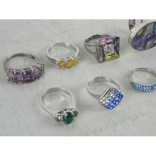 324 - Six Sterling silver dress rings and two others.