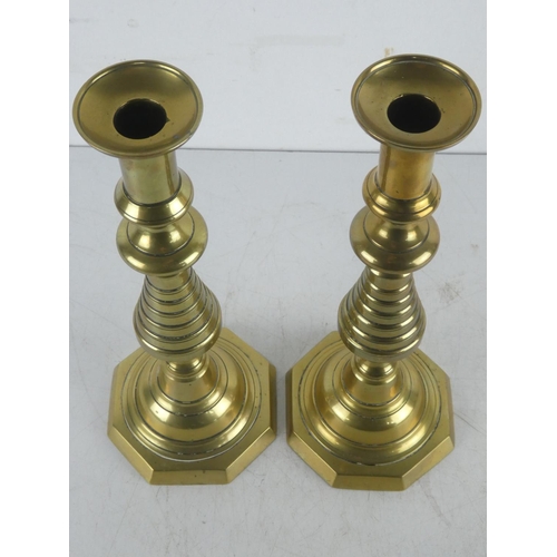 398 - A pair of vintage brass candlesticks.