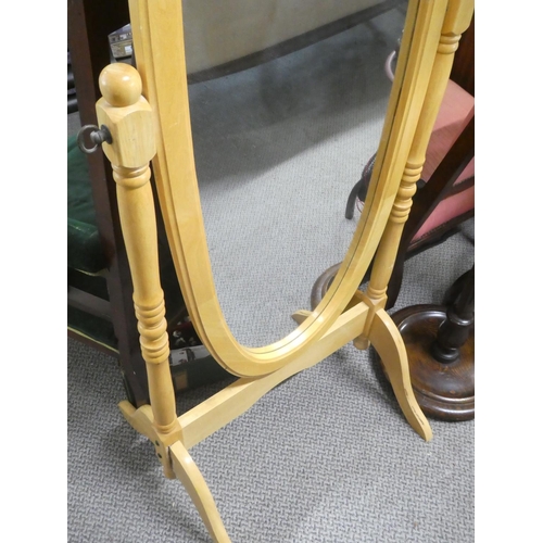 500 - A pine framed cheval mirror.