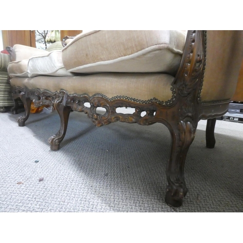 507 - An antique style three seater couch with button back detail and carved frame.