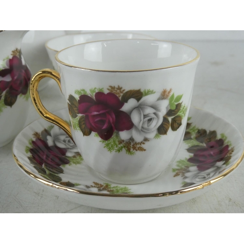 512 - A vintage Royal Imperial bone china coffee set.