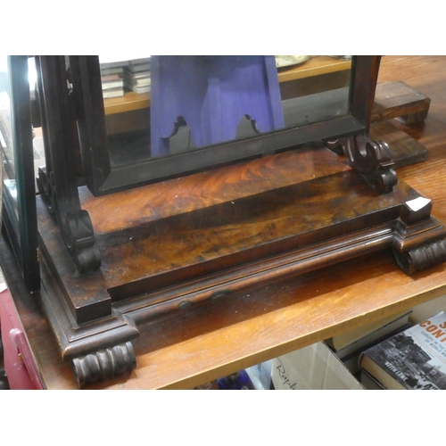 513 - An antique walnut dressing table mirror with scroll detail.