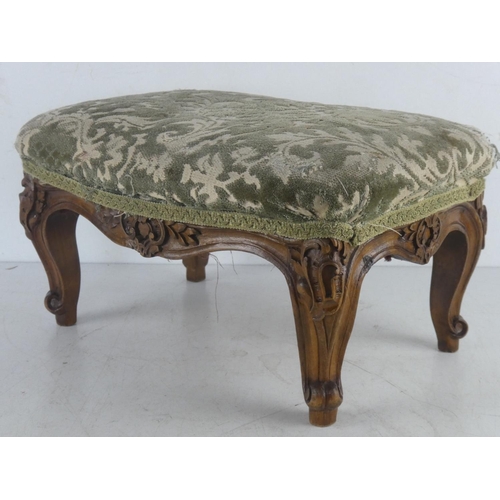 519 - A small upholstered footstool.