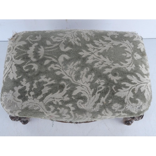 519 - A small upholstered footstool.