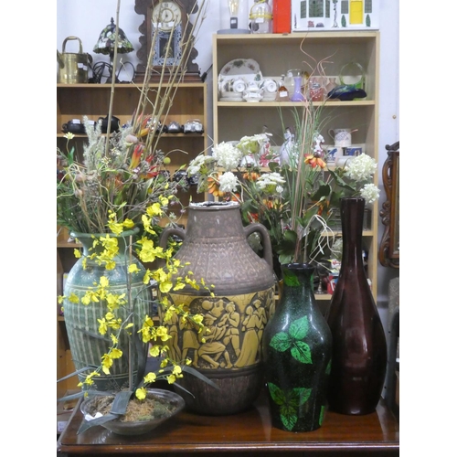 528 - A large quantity large vases, floral displays etc.