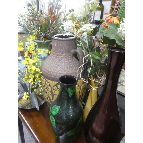 528 - A large quantity large vases, floral displays etc.