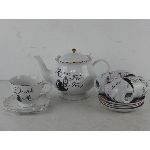 536 - A set of four Next cup and saucers and a Disney 'Alice in Wonderland' teapot and more.