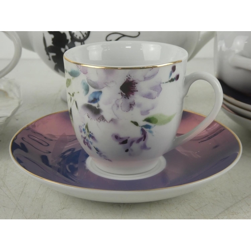 536 - A set of four Next cup and saucers and a Disney 'Alice in Wonderland' teapot and more.