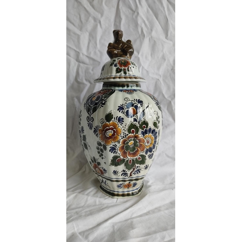 426 - A Danish Delft Polychroom Holland lidded pottery vase.