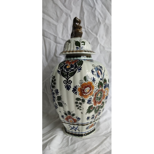 426 - A Danish Delft Polychroom Holland lidded pottery vase.