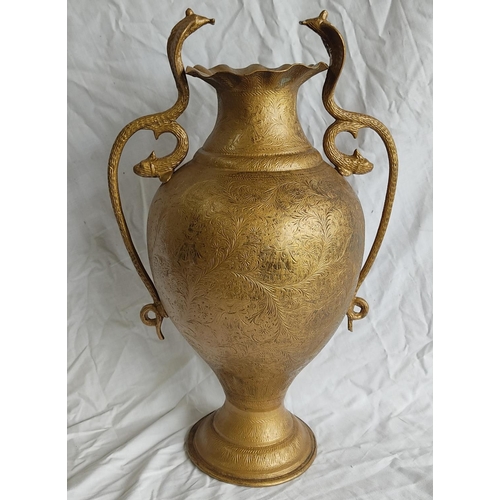 429 - A large Indian brass vase with Cobra snake and fish style handles.