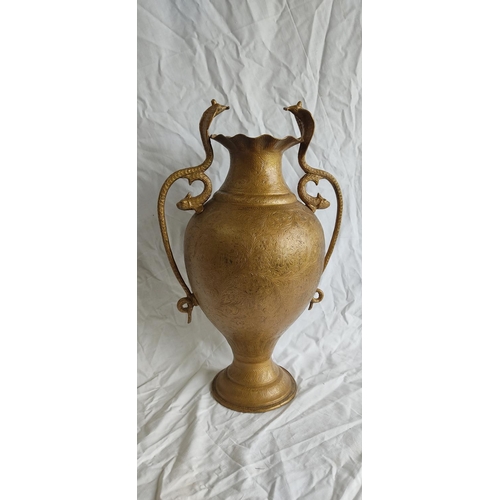 429 - A large Indian brass vase with Cobra snake and fish style handles.