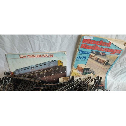 446 - A vintage Tri-ang model railway track and two booklets.