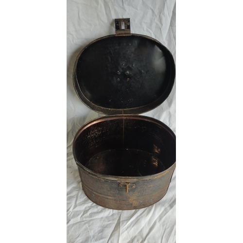 460 - An antique metal hat box.