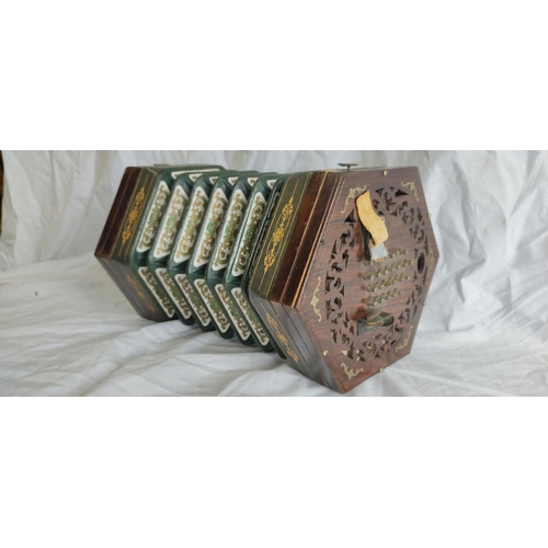 463 - A stunning antique oak and brass detailed concertina.